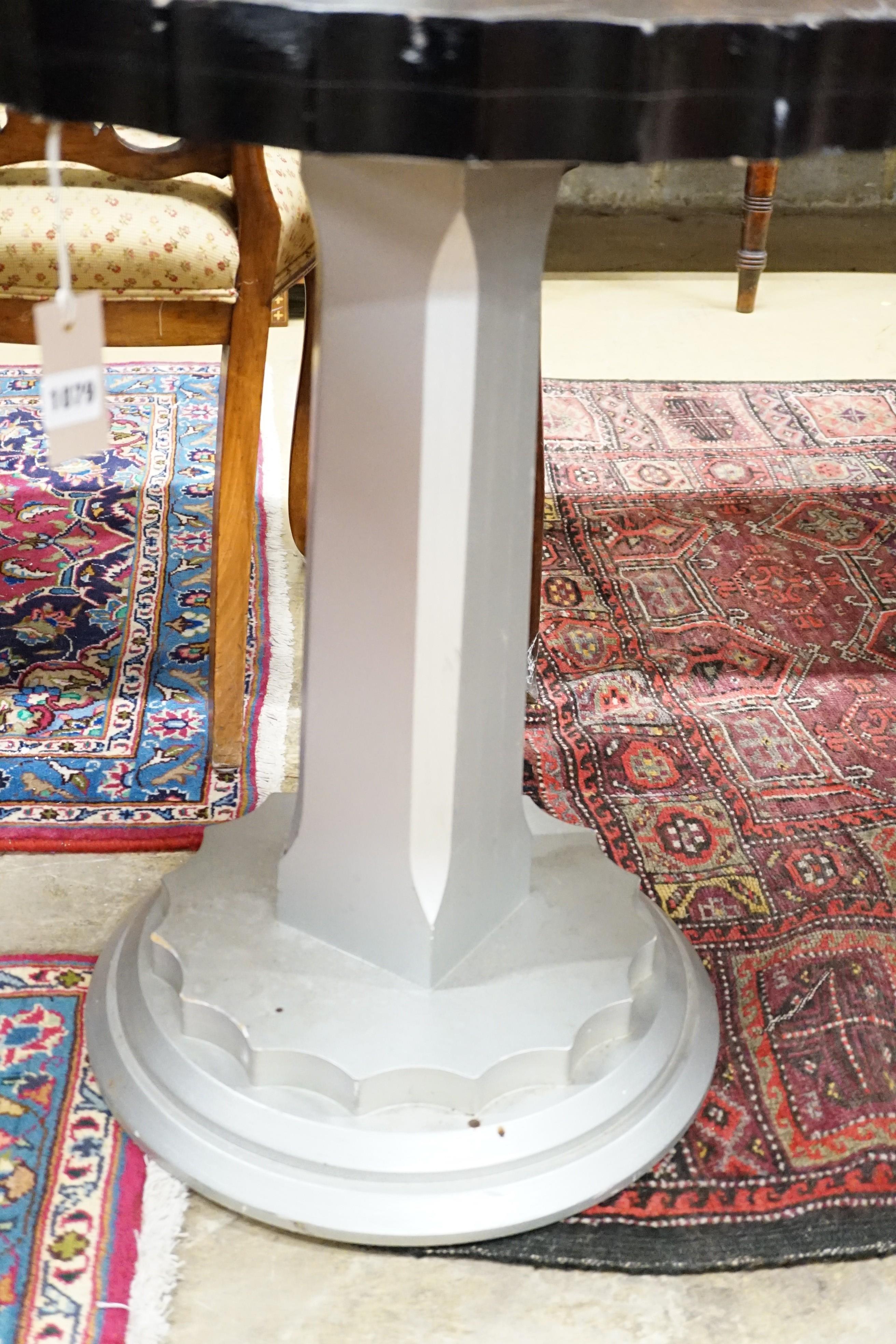A pair of Art Deco ebonised and silvered wood occasional tables, diameter 60cm, height 71cm